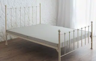 4-inch unsprung bed base with traditional butcher's stripe ticking