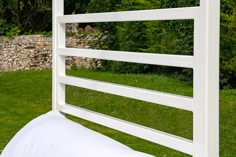Side angle of Sunna bed frame with white finish