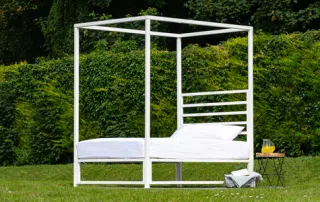 Sunna outdoor bed frame in garden – front view