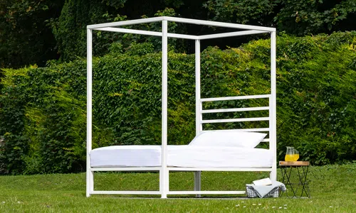 Sunna outdoor bed frame in garden – front view