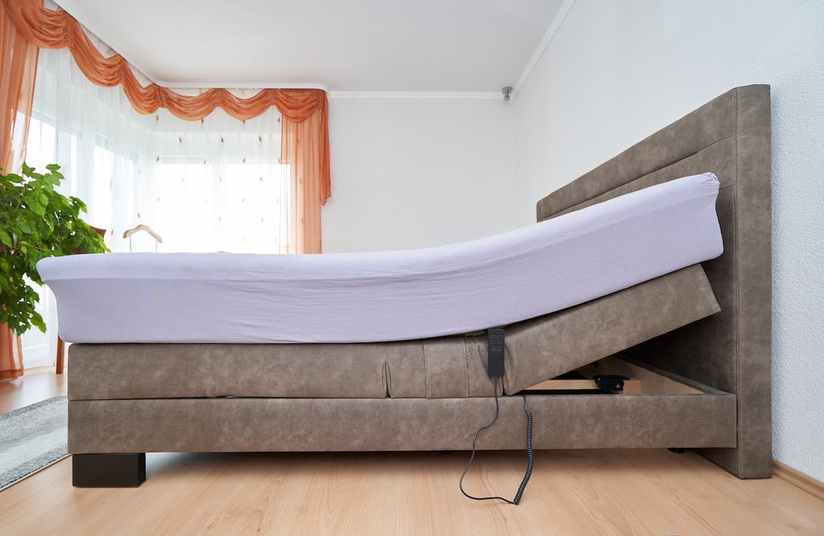 Side view of an adjustable divan bed