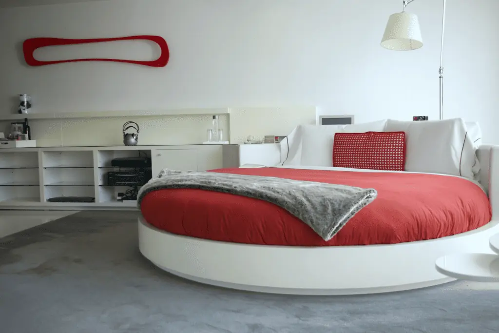 Retro round bed with red bedding