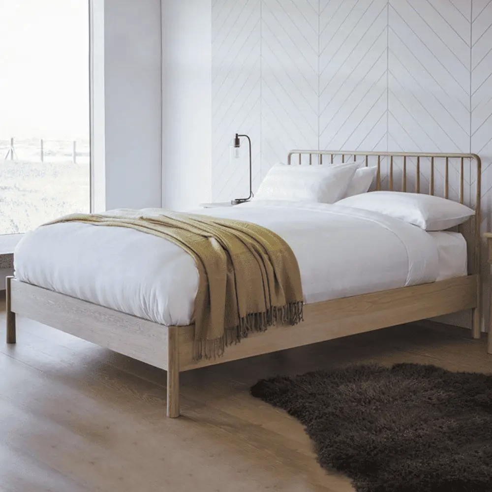 Modern spindle bed in a white room