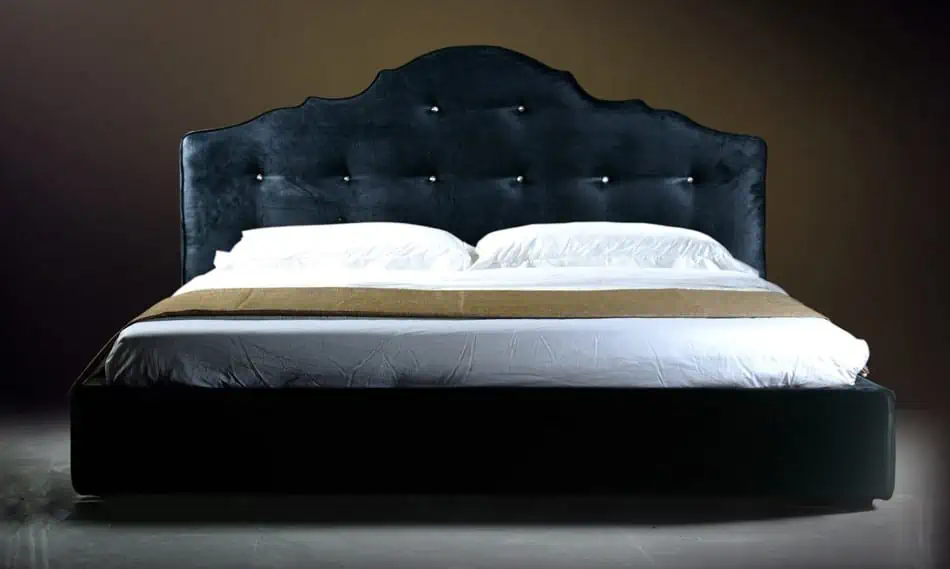 Dark velvet upholstered bed
