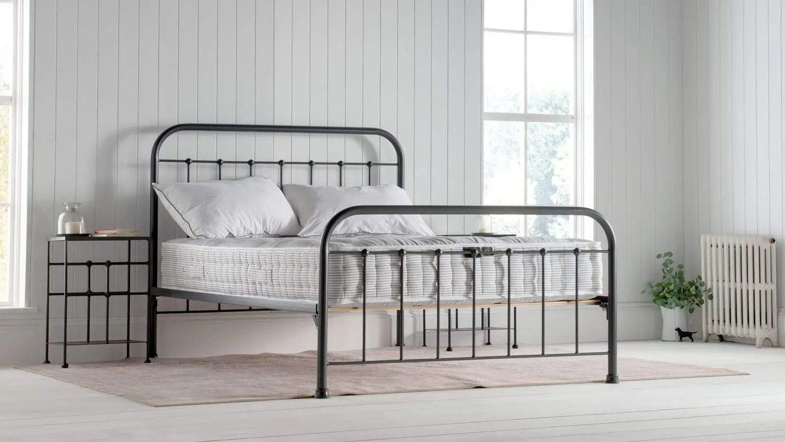 NC-1000-1200-1500-Landscape_Web natural fibre mattress on dark grey dormatory style iron bedframe, in a white / coastal inspired bedroom.