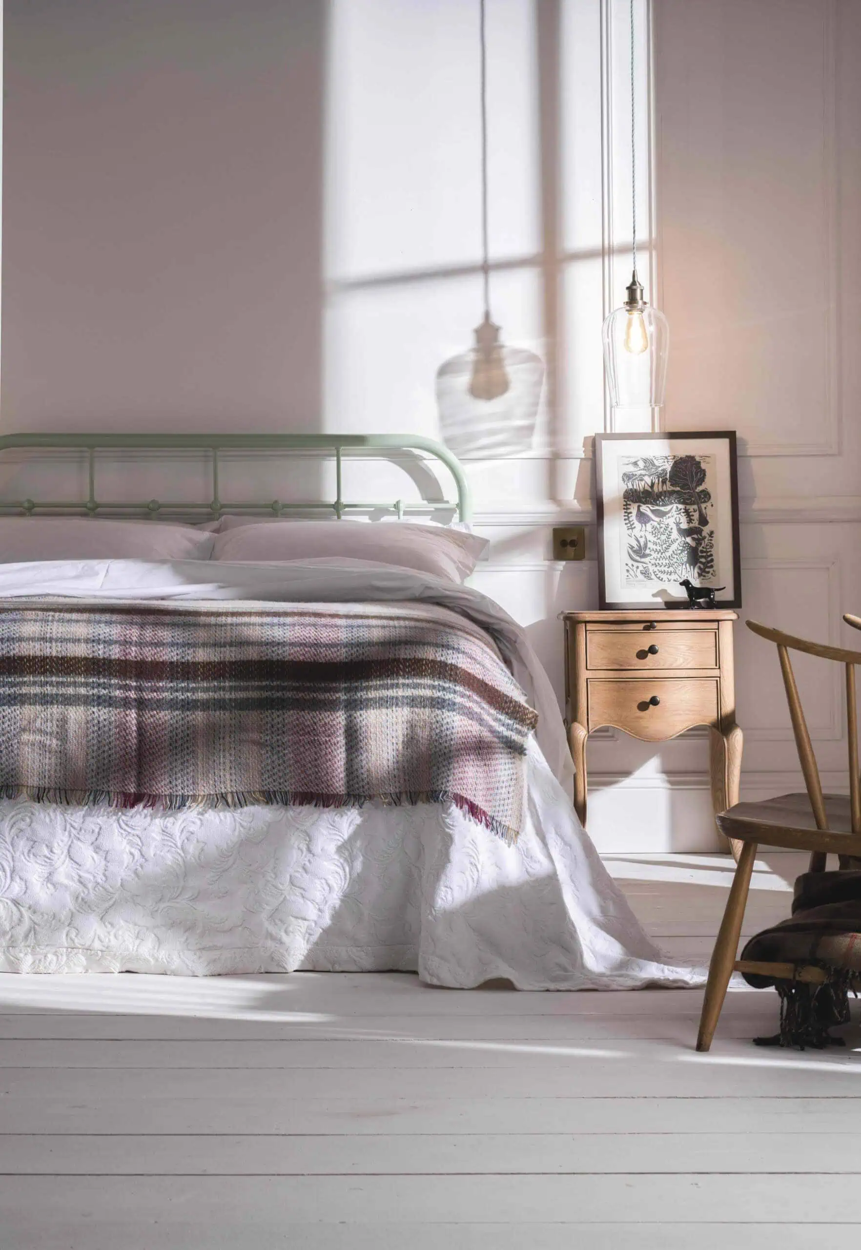 green iron bed with bedroom lighting glass pendants