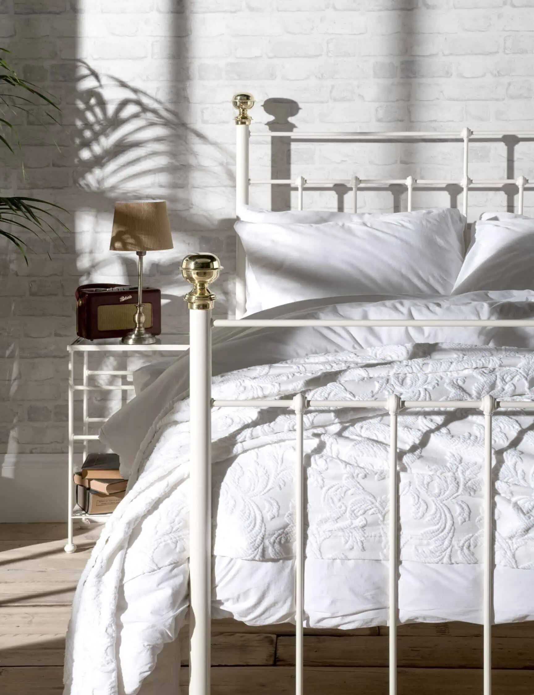 Charlotte iron bed in sunshine with white bedding