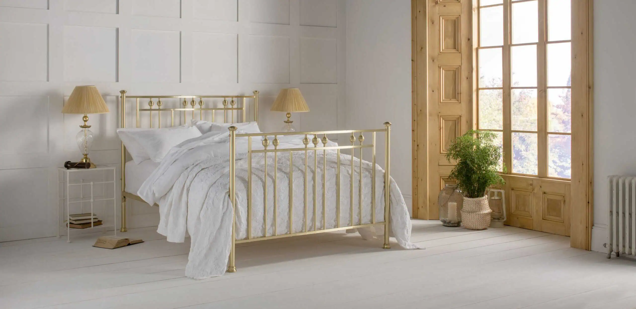 Rosie brass bed with white bedding in cool white room
