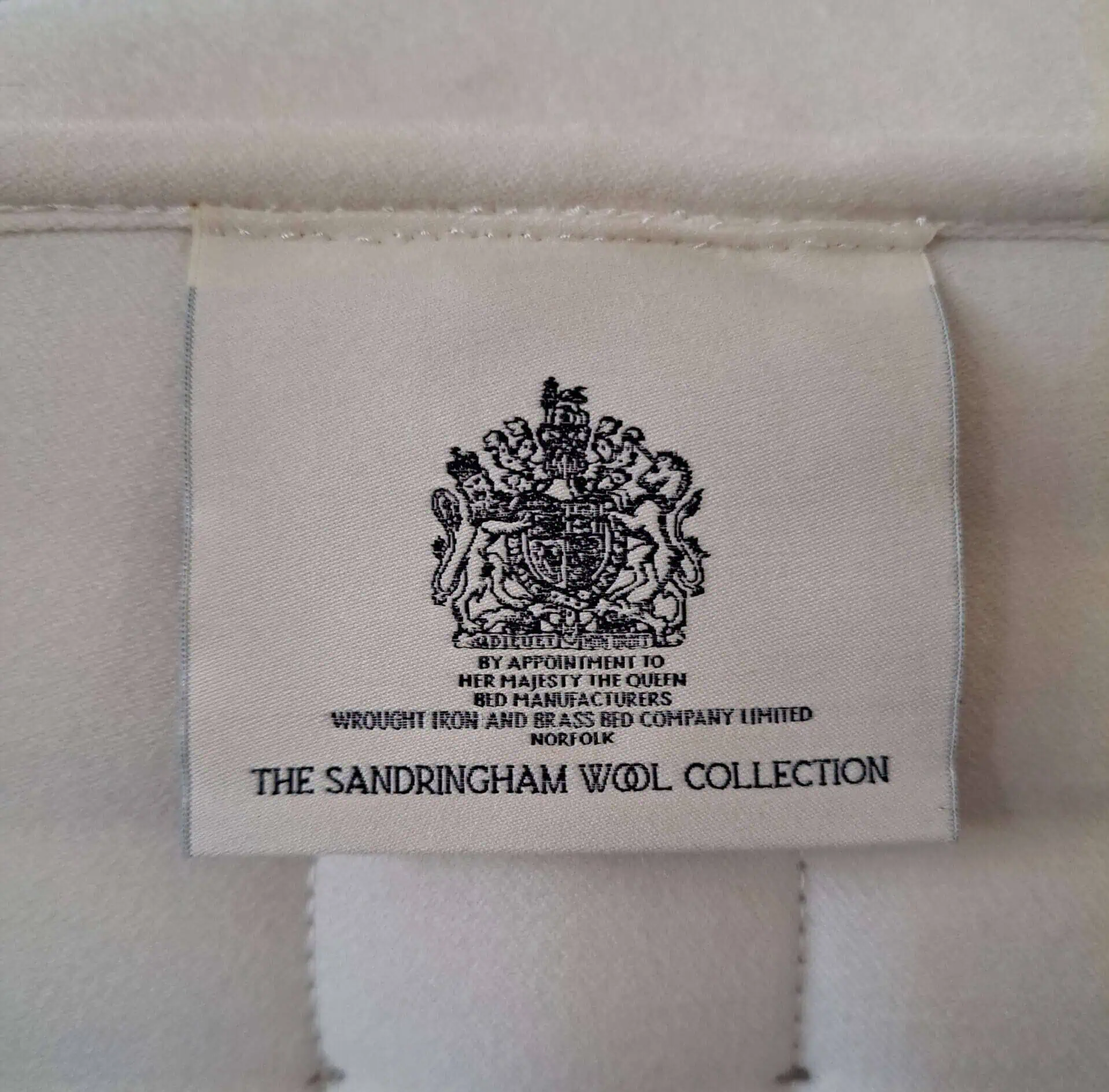 Label from Wrought Iron and Brass Bed, Sandringham Wool Collection.