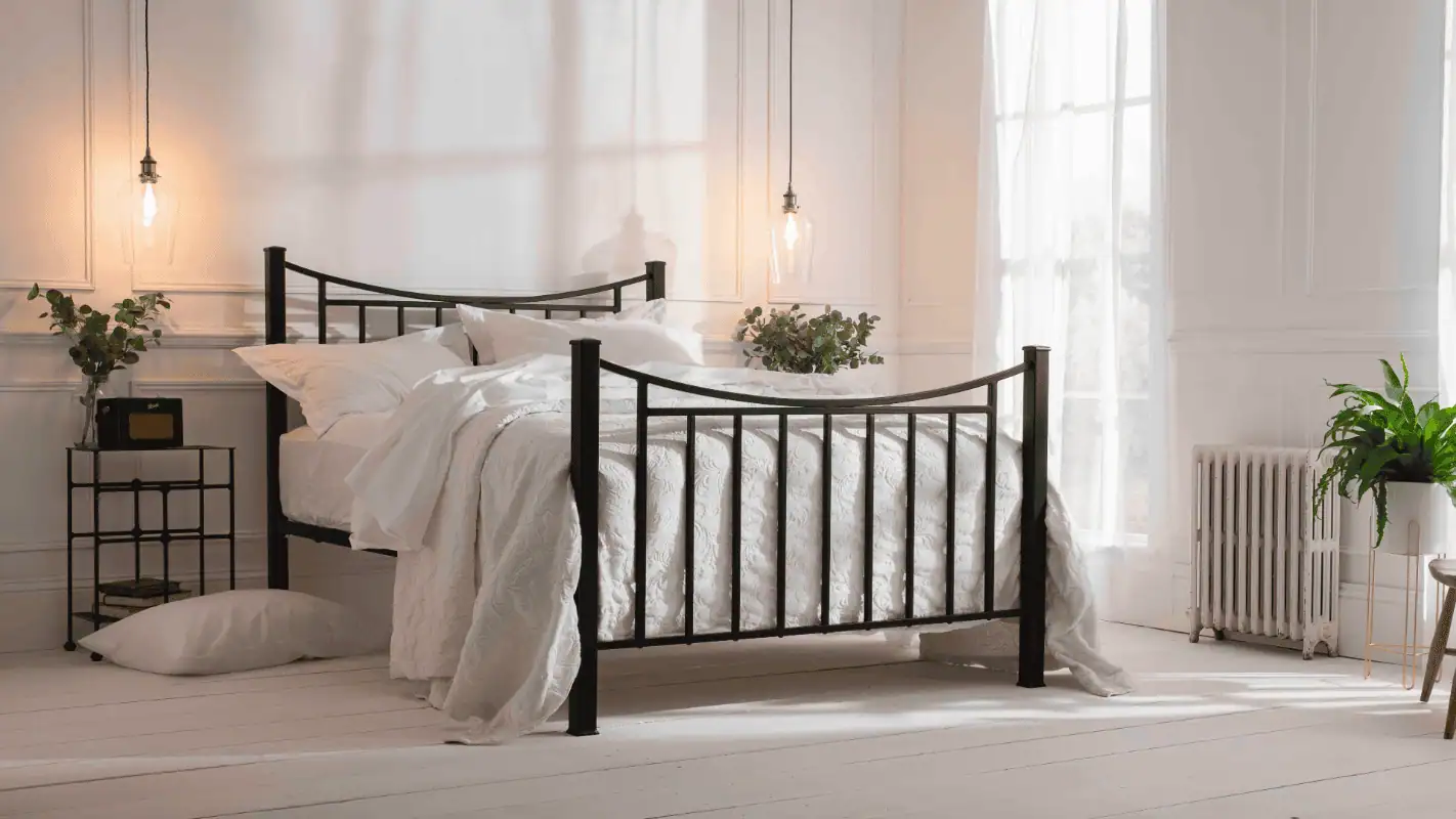 Shown is one of our handcrafted beds, Inca. alongside this bed is some loving healthy plants in an eco-friendly bedroom. The bedding and mattress are both ethically sources from British Wool. 