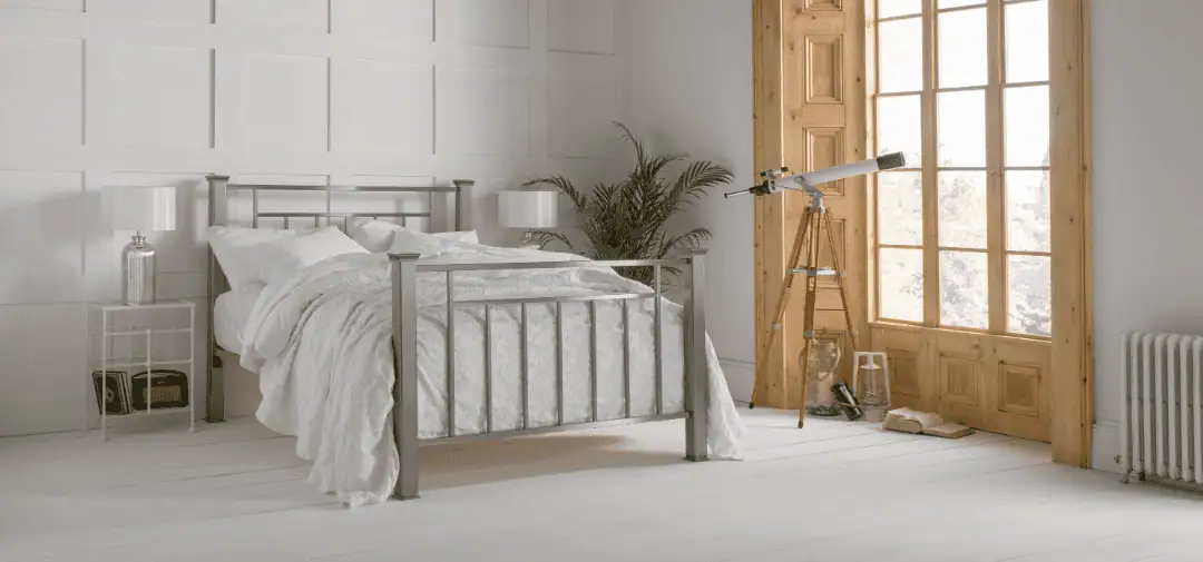 Shown is one of our handcrafted beds, Inca. alongside this bed is some loving healthy plants in an eco-friendly bedroom. The bedding and mattress are both ethically sources from British Wool. 
