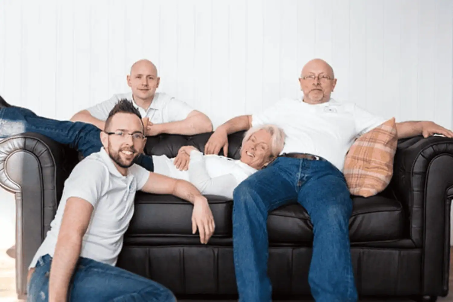 Amanda Oldfield and her family sitting together, founders of Wrought Iron & Brass Bed Co.