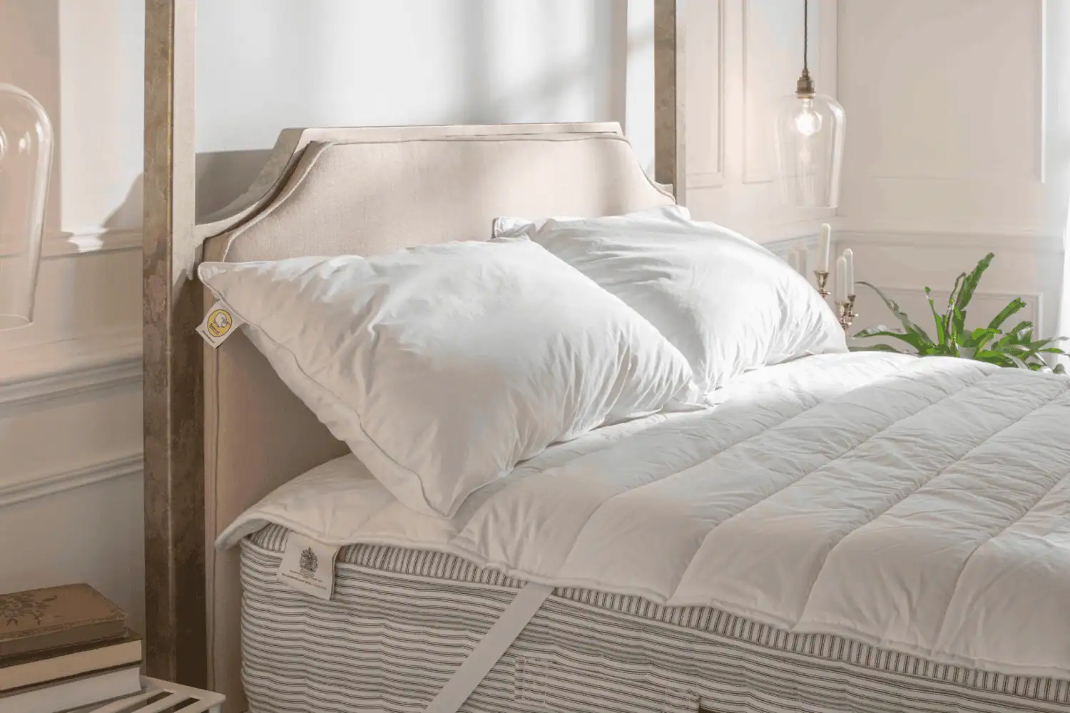 Luxury pillows and bedding on a handmade bed frame
