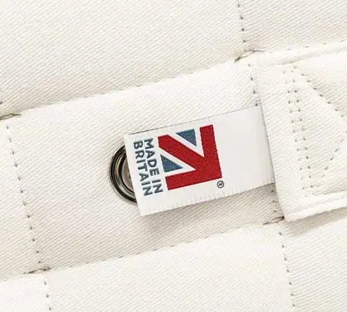 Close-up of British Made mattress label on white fabric.