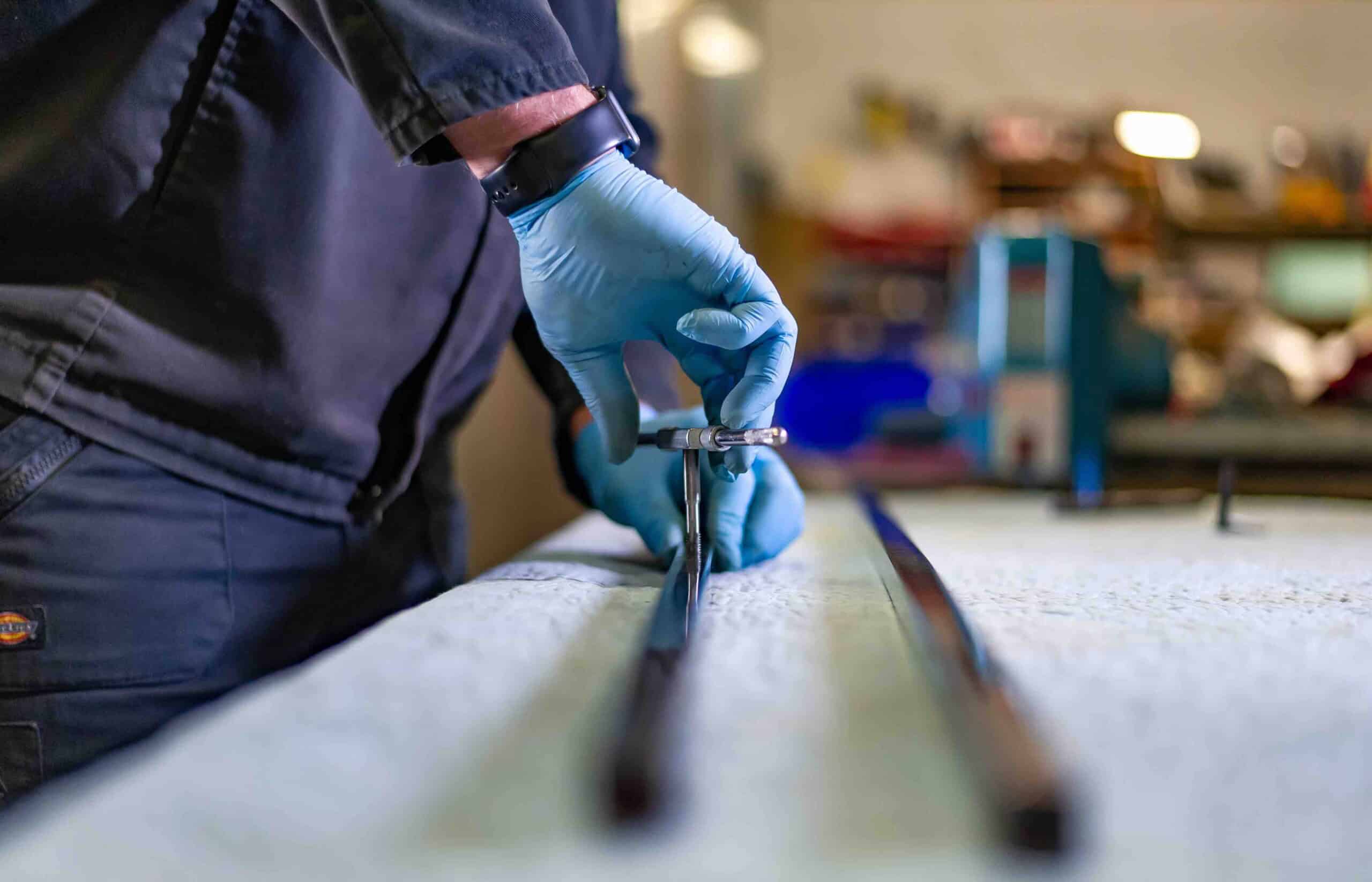 Hand-finishing a British-made wrought iron bed