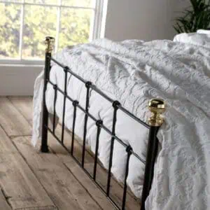 Isaac iron bed tailboard in black with brass finials