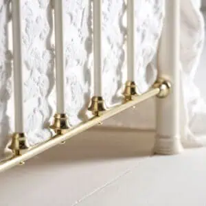 Lottie brass bed tailboard details
